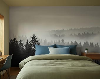 May include: A bedroom featuring a forest mural, a bed with blue cushions and a green duvet, and a wooden bedside table. A desk with a chair is near a large window. The room has a neutral colour palette.