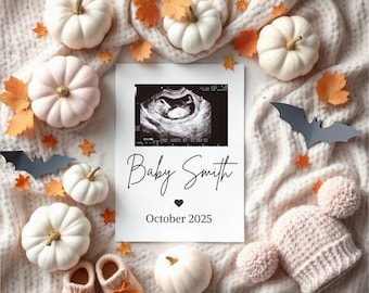 May include: A white card with a black and white ultrasound image of a baby. The card has the text "Baby Smith" and "October 2025". The card is surrounded by white pumpkins, fall leaves, and a pink baby hat.