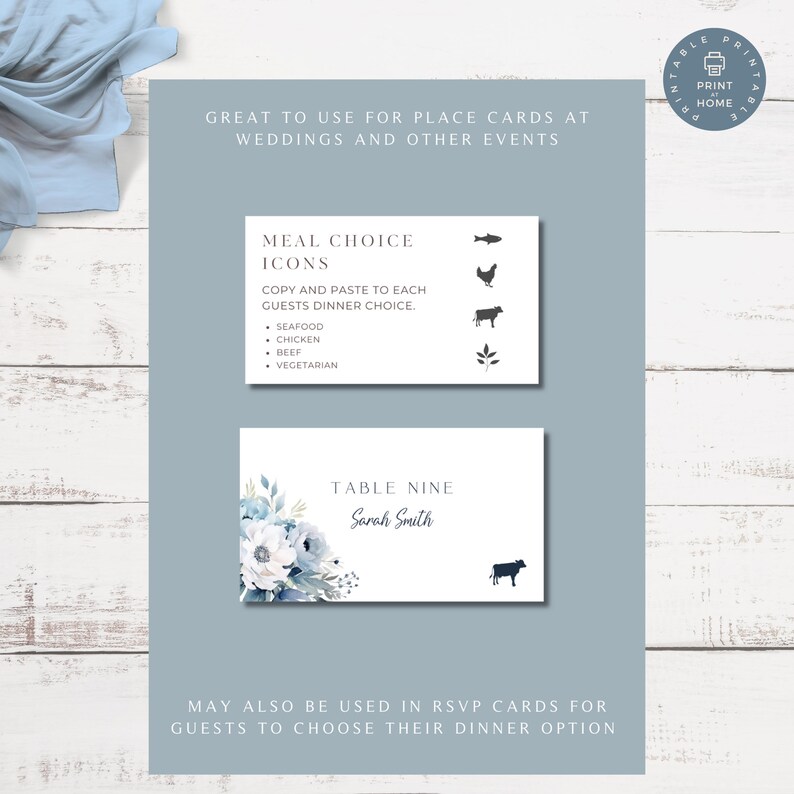 May include: Printable place cards with a blue floral design and the text "Table Nine Sarah Smith". The cards are designed for weddings and other events and include icons for meal choices: seafood, chicken, beef, and vegetarian.