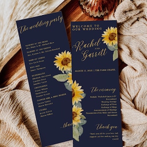 May include: A navy blue wedding program with gold lettering and sunflower illustrations. The program includes the names Rachel and Garrett, the date March 11, 202X, and the location The Farm Chapel. The ceremony details are listed, including the prelude, processional, wedding message, exchange of vows, exchange of rings, announcement of marriage, presentation of the bride and groom, and recessional. The program also includes a thank you message.