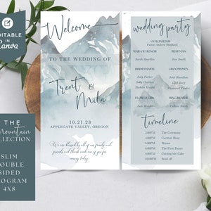 May include: A wedding program with a mountain theme. The front features a watercolor mountain range in shades of blue and gray. The text reads "Welcome to the wedding of Trent & Mila" and "10.21.23 Applegate Valley, Oregon". The back features a wedding party list, timeline, and the text "Wedding Party" and "Timeline".
