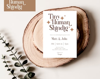 May include: A white baby shower invitation with brown text that reads "Tiny Human Shindig". The invitation includes the names "Matt & Julia", the date "FRI | NOV 13 | 7pm", and the location "Oak Grove Winery, Applegate Valley, Oregon".