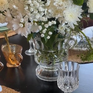 May include: A set of three ceramic mugs with a speckled, matte finish. The mugs are in shades of cream, light gray, and dark gray. Each mug has a simple, minimalist design, perfect for coffee or tea.