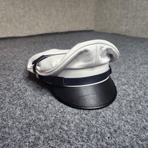 May include: A set of three ceramic mugs with a speckled, matte finish. The mugs are in cream, light grey, and dark grey. Each mug has a simple, modern design and a rounded handle. Ideal for tea or coffee.