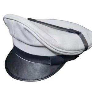 May include: A white and black hat with a curved top and a black brim. The hat has a black strap across the top and is likely made of leather or a similar material. The hat is a classic style.