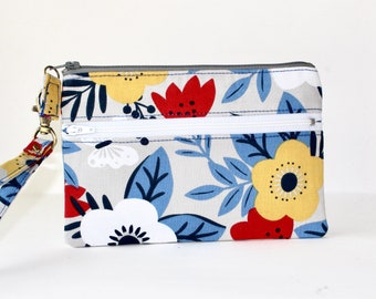 7" Double Zipper Wristlet. 2 Zipper Wristlet. Double Zip Pouch with Strap. Double Zipper Pouch with Blue, Yellow, Red, and White Flowers