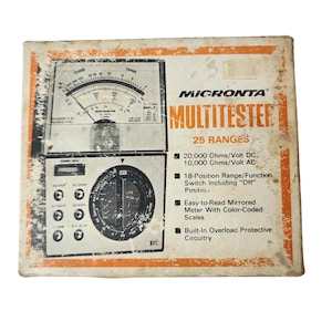 May include: A vintage Micronta Multitester in its original box. The box is off-white with orange trim and features a meter with a needle and a rotary dial. Text on the box includes "MULTITESTER" and "25 RANGES".