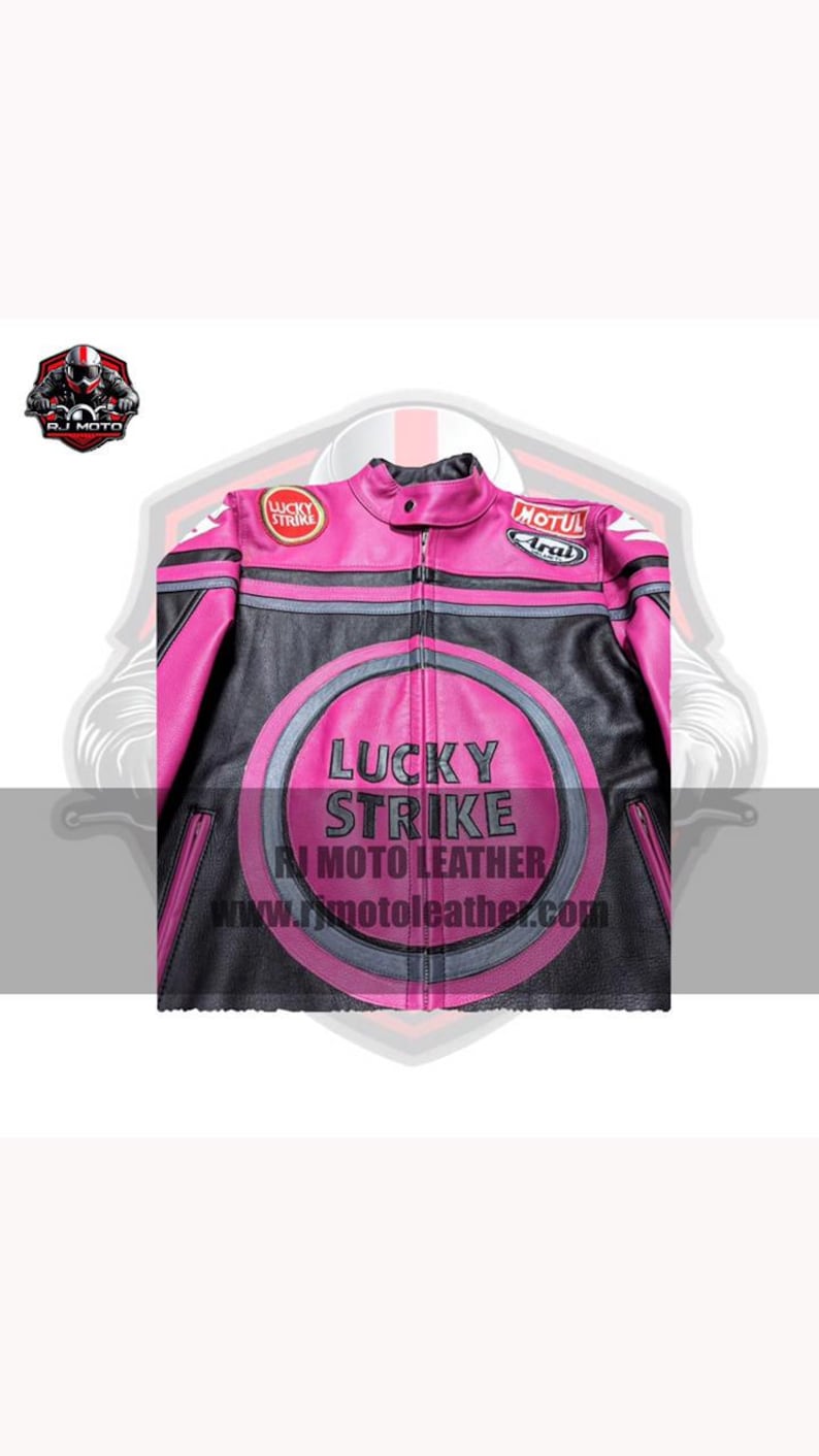 May include: Pink and black motorcycle jacket featuring the "Lucky Strike" logo. The jacket has a zip-up front, a round collar, and patches on the sleeves. The jacket has a website address printed on the front.