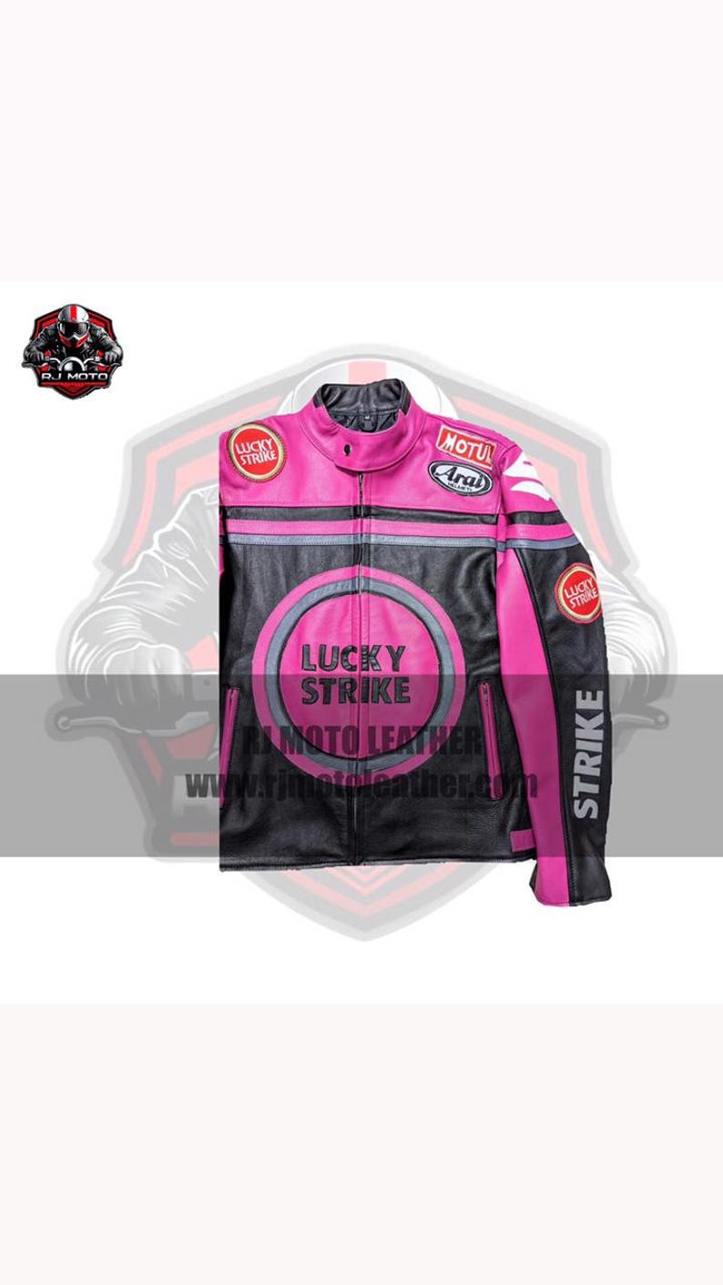 May include: Black and pink leather motorcycle jacket with "LUCKY STRIKE" and "STRIKE" text. Features a round emblem on the chest and patches on the sleeves. The jacket has a zipper closure and a stand-up collar.