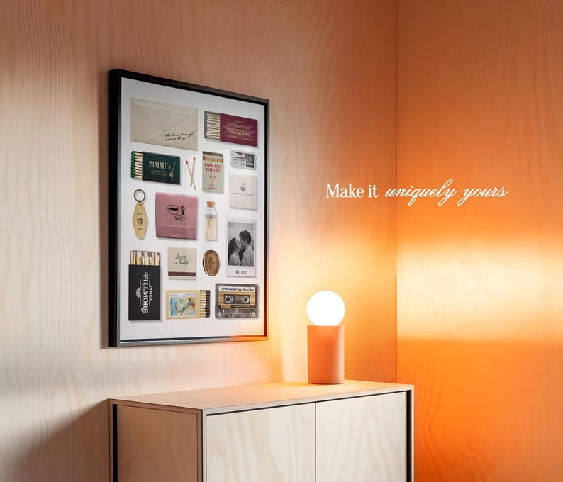 May include: A framed collage of vintage ephemera, including matchbooks, keys, and a small photo, on a light wood wall with a small table lamp. The text "Make it uniquely yours" is visible in the upper right corner of the image.