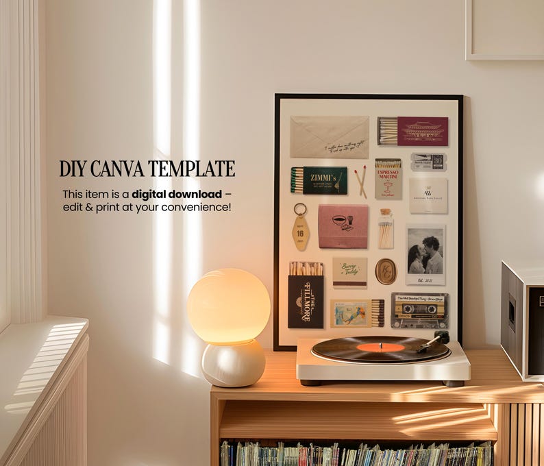 May include: A framed collage of vintage matchboxes, photos, and other ephemera. The collage is in a black frame and is hanging on a white wall. A lamp and a record player are on a wooden shelf below the collage.