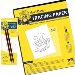 May include: A pack of two brown Aunt Martha's Hot Iron Transfer Pencils, a yellow and black package of 50 sheets of 8.5 by 12 inch tracing paper, and a sample design of a teacup with steam coming from it. The tracing paper is for creating iron-on embroidery transfer patterns.