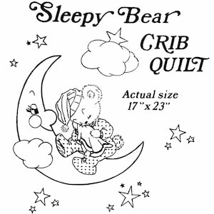 May include: Black and white illustration of a bear sleeping on a crescent moon with stars and clouds. The text "Sleepy Bear Crib Quilt" and "Actual size 17" x 23" is included.