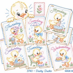 May include: A set of embroidered fabric squares featuring yellow ducklings performing daily tasks labelled with the days of the week. Each square shows a duckling with activities like washing, sewing, or baking. Text includes Monday through Sunday.
