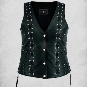 May include: Black leather vest with a V-neck and a classic lace-up style. The vest features white eyelets and black laces along the sides, with three white buttons down the front. The text "Classic lace Style Leather Vest" is at the top.