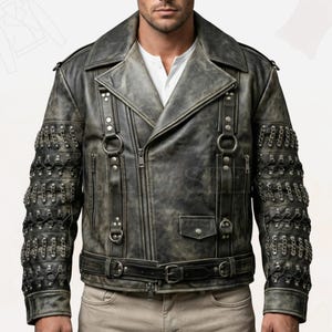 May include: A distressed grey leather jacket with an asymmetrical zip, notched collar, and waist belt. The jacket has metal chain detailing on the sleeves and multiple pockets. A stylish outerwear piece, the jacket is a classic biker style.