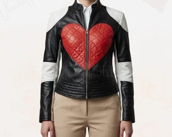 May include: Black leather jacket with a quilted red heart design on the front. The jacket has white accents on the shoulders and sleeves. It features a zipper closure and a stand-up collar.