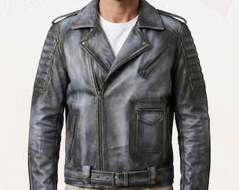 May include: A distressed gray leather jacket with a classic biker style. Features include a notched collar, asymmetrical zipper, multiple zippered pockets, and a belted waist. The jacket has padded shoulders and a weathered appearance.