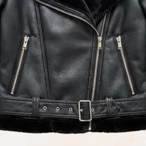 close-up-of-asymmetrical-zipper-closure-on-womens-leather-coat