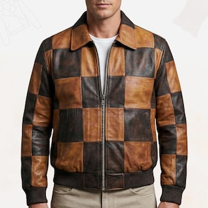 Puede incluir: Chaqueta de cuero a cuadros marrón y negro con cierre de cremallera. La chaqueta tiene cuello y puños y dobladillo de canalé. La chaqueta parece estar hecha de cuero de alta calidad.