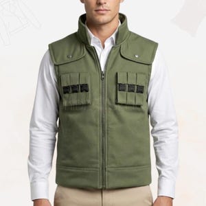 May include: Olive green vest with a high collar, two flap pockets with black buckles, and a full-length zipper. The vest is worn over a white collared shirt.