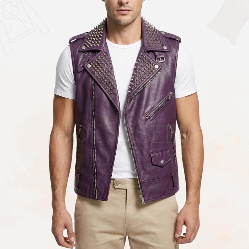 May include: A sleeveless purple leather vest with silver metal studs on the collar. The vest has a zipper closure, multiple pockets, and a tailored fit. The model is wearing a white t-shirt and khaki pants.