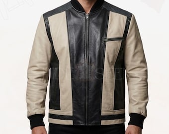 May include: A leather bomber jacket with a black collar, black and beige panels, and a black zipper. The jacket has black ribbed cuffs and a small zippered pocket on the chest. The jacket is made of leather.