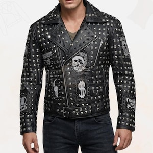 May include: Black leather jacket with silver studs and patches. The jacket features a classic biker style with a notched collar, asymmetrical zipper, and multiple pockets. Patches include skull and dollar sign graphics.