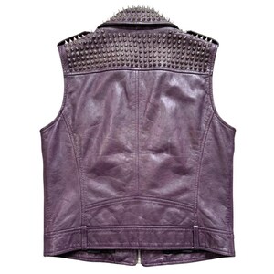 May include: A purple leather vest with a studded collar. The back of the vest is visible, showcasing the stitching and design. The vest has a zipper closure and a fitted silhouette, perfect for a rock and roll aesthetic.