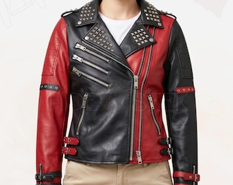 May include: A two-tone black and red leather jacket with silver stud accents on the shoulders and collar. The jacket features multiple zippered pockets, a diagonal zipper closure, and buckle details on the sleeves and waist.