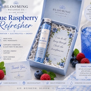 May include: A light blue gift box containing a glass tube of blue raspberry drink mix and a card with the text I can do all things through Christ who strengthens me. Includes a thank you card, a glass of blue drink with berries, and text.
