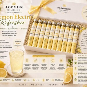 May include: A white gift box containing twelve glass vials of Lemon Electro Refresher drink mix, topped with a yellow ribbon. The box includes a scripture card, and the packaging features text detailing hydration, electrolyte, and energy benefits.