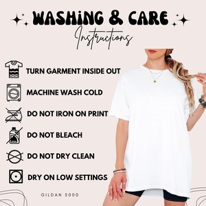 May include: White t-shirt with washing instructions. The text reads: Turn garment inside out, machine wash cold, do not iron on print, do not bleach, do not dry clean, dry on low settings. The brand is Gildan 5000.