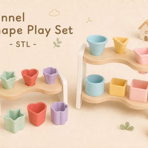 May include: A Funnel Shape Play Set STL featuring two wooden stands with white legs and light wood platforms. The set includes various pastel-colored silicone funnels in star, heart, flower, circle, square, and triangle shapes, along with small decorative wooden house, tree, and rabbit figures.