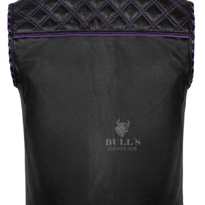 May include: Black leather vest with purple stitching and trim. The back features a quilted pattern with diamond stitching. The vest has the "BULL'S LEATHER HUB" logo.