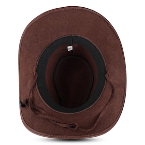 May include: A brown leather cowboy hat with a black leather band and a brown leather chin strap.