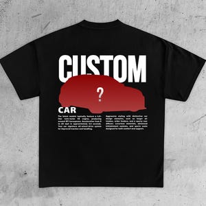 May include: Black t-shirt with the word "CUSTOM" in white block letters above a red car silhouette with a question mark. Below the car is the word "CAR" and text describing car features.