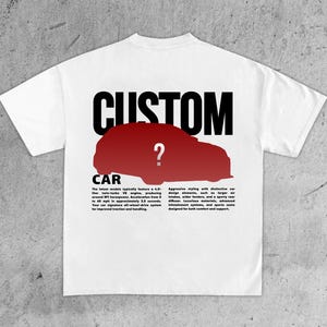 May include: White t-shirt with a graphic design featuring the word "CUSTOM" above a red car silhouette with a question mark. Below the car, the word "CAR" is printed. Additional text describes car features.