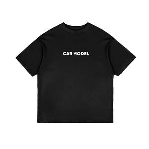 May include: Black t-shirt with the white text "CAR MODEL" centered on the chest. The shirt has short sleeves and a crew neck. The fabric appears to be a soft, opaque material.