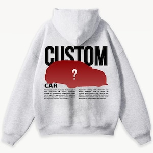 May include: A light gray hoodie with the word "CUSTOM" in large black letters above a red car silhouette with a question mark. The word "CAR" is below the car silhouette, with text describing car features.