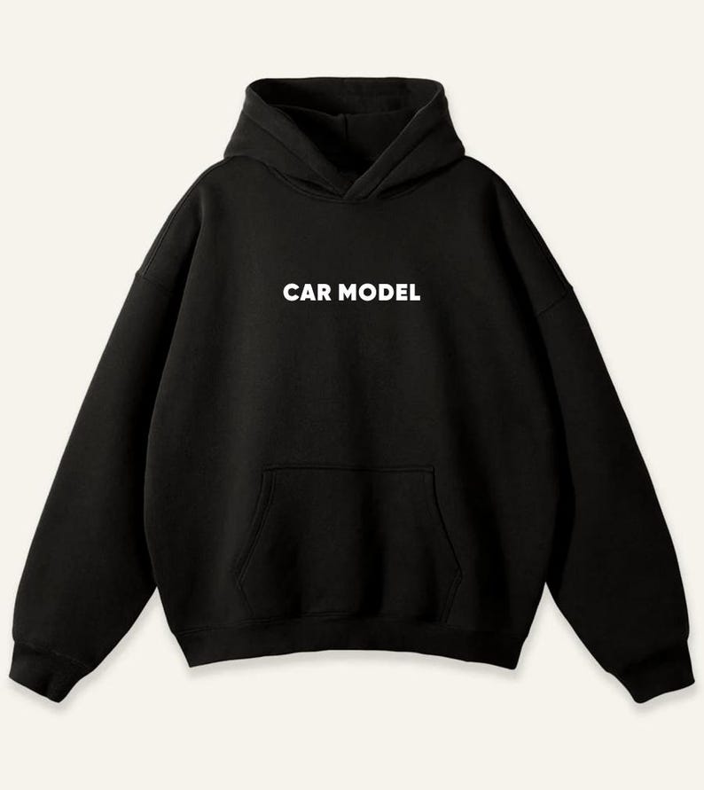 May include: Black hoodie with a hood and a front pocket. The words "CAR MODEL" are printed in white block letters across the chest. The sweatshirt has long sleeves and a relaxed fit.