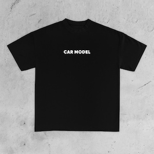 May include: Black t-shirt with the white text "CAR MODEL" centered on the chest. The shirt has short sleeves and a crew neck. The fabric appears to be a soft, comfortable material, suitable for casual wear.