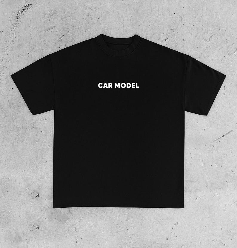 May include: Black t-shirt with the white text "CAR MODEL" centered on the chest. The shirt has short sleeves and a crew neck. The fabric appears to be a soft, comfortable material, suitable for casual wear.