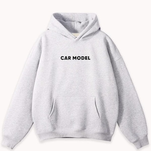 May include: A light gray hoodie with a front pocket and a hood. The text "CAR MODEL" is printed in black across the chest. The sweatshirt is made of a soft material.
