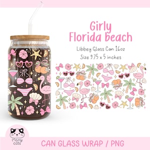 May include: A pink and green can glass wrap with a girly Florida beach theme. The wrap features palm trees, flamingos, sunglasses, seashells, and bikini tops. The text "Girly Florida beach" is at the top of the wrap. The text "Libbey Glass Can 16oz" and "Size 9.75 x 5 inches" is below the design. The wrap is designed to fit a 16oz Libbey glass can.