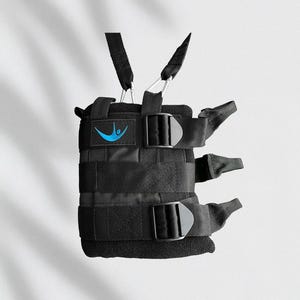 May include: Black weight vest with adjustable straps and buckles. Features a blue logo on the front. The vest has multiple straps and is designed for fitness training.