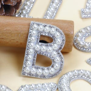 Iron-On Pearl Letter Patches A-Z, Elegant White Alphabet Appliques for DIY Crafts, Sewing Projects, Clothes & Bags