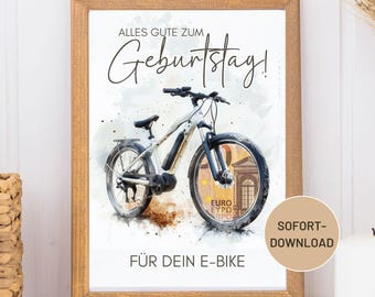 May include: A framed print with a watercolor illustration of a white and black e-bike. The bike's wheels feature a euro bill design. Text includes "ALLES GUTE ZUM Geburtstag!" and "FÜR DEIN E-BIKE". A "SOFORT-DOWNLOAD" sticker is in the corner.