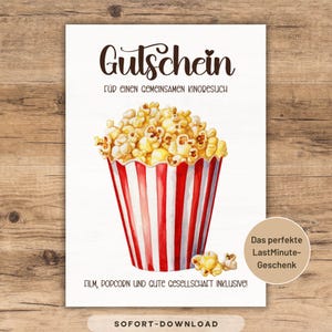 Peut inclure: Carte blanche avec le mot "Gutschein" en script marron, avec une illustration à l'aquarelle d'un seau de pop-corn à rayures rouges et blanches. Le texte comprend "Pour une visite de cinéma partagée" et "Film, pop-corn et bonne compagnie inclus !"