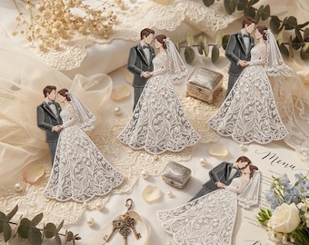 May include: Four embroidered fabric appliques depicting a bride in a white lace gown and a groom in a black tuxedo. The set includes small metal boxes, vintage-style keys, white pearls, dried flowers, and a paper menu card with elegant script.
